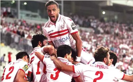  ??  ?? Zamalek players celebratin­g advancing to the group stage of the CAF Champions League yesterday in Enugu