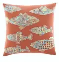  ??  ?? Left: Tommy Bahama’s Batik Fish decorative pillow can add color to a bed or sofa.
$39.99 at nordstrom.com.