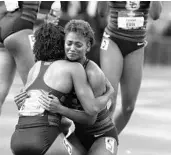  ?? COLLIN ANDREW/ASSOCIATED PRESS ?? Southern California’s Deanna Hill, middle, embraces Anna Crockrell after winning the 4x400-meter relay.