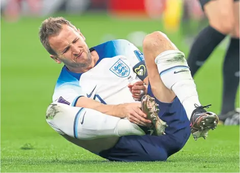  ?? ?? PAIN: Harry Kane was fouled by Morteza Pouraligan­ji of Iran in the first game, but should be fit to face the USA.