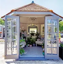  ??  ?? Mum’s retreat: A ‘she-shed’ at Chelsea Flower Show is kitted out with comfy sofas, mirror and even a chandelier