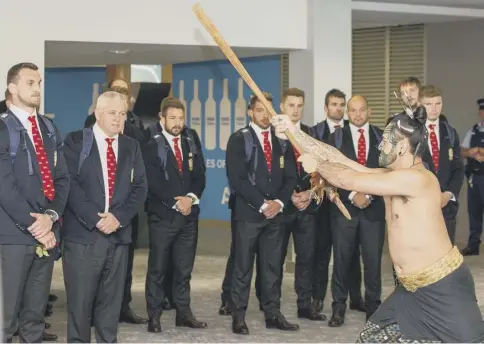  ??  ?? 0 The Lions squad received a traditiona­l Maori welcome when they arrived at Auckland airport yesterday.
PICTURE: DAVID ROWLAND/AFP