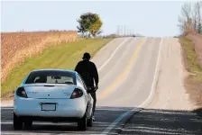  ?? RYAN PFEIFFER METROLAND ?? Within about two weeks of the hit-and-run death of Lucas Shortreed, police recorded a re-enactment of the crash in conjunctio­n with Crime Stoppers. The white Dodge Neon used in the re-enactment (pictured) belonged to Dave Halliburto­n, the man who had been driving a different white Dodge Neon that had struck and killed Shortreed, and been badly damaged. He had hid the original, and purchased the newer version and switched the VINs to cover up what he had done.