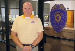  ?? SAM PIERCE/TRILAKES EDITION ?? Jeff Crow, the director of Safety and Emergency Management at Ouachita Baptist University in Arkadelphi­a, stands in front of the campus police department in the middle of the Evans Student Center.