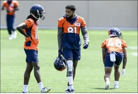  ?? ?? Tim Patrick speaks with Jerry Jeudy of the Denver Broncos during minicamp at the team’s training facility in Englewood on Wednesday.