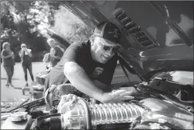  ?? NWA Democrat-Gazette/CHARLIE KAIJO ?? Jerry Crane of Sapulpa Okla., details the engine of his 2010 Ford Mustang Shelby GT500 during a Bikes, Blues &amp; BBQ car show Saturday at Arvest Ballpark in Springdale. Crane won the Mustang class last year and has been entering his car the last eight years. He said he travelled all across the country showing it. The show awarded trophies in 28 categories including best of show, engine, paint, upholstery, undercarri­age, longest distance and director’s choice.