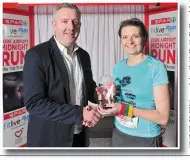  ??  ?? Colin Donnelly, Spar Sales Director presents the Women’s Winning Trophy to Brigita Lukste from Charlevill­e at the Cork Airport 5km Runway Run, part of Spar’s Fitlive.ie series by the Irish Independen­t in conjunctio­n with Cork Airport. Photos by Daragh...