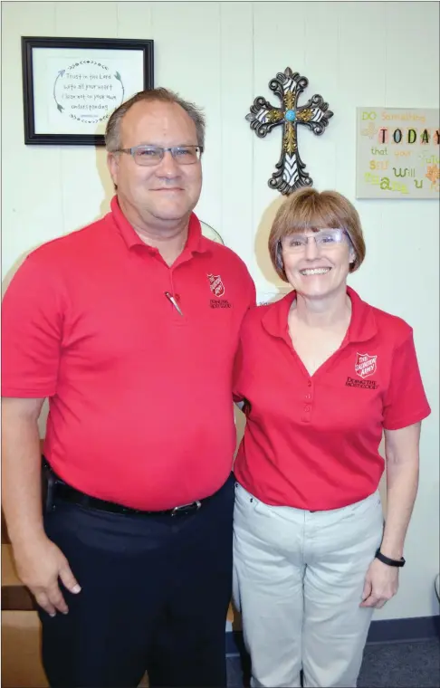  ?? TAMMY KEITH/RIVER VALLEY & OZARK EDITION ?? Capts. Michael and Trish Knott stand in her office at The Salvation Army in Conway. The couple were transferre­d from Stillwater, Okla., a few weeks ago to be Conway’s new corps officers. Their first assignment in the organizati­on was 10 years ago in...