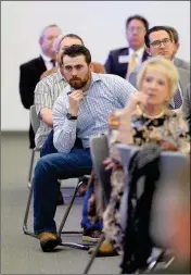  ??  ?? MEMBERS OF A PACKED AUDIENCE LISTEN as Ducey delivers his State of the State address at AWC.