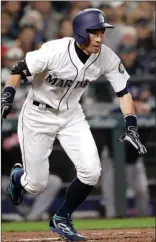  ?? The Associated Press ?? Seattle Mariners outfielder Ichiro Suzuki takes off for first on a grounder against the Cleveland Indians during the third inning Thursday in Seattle. Suzuki was out on the grounder to first and went 0-for-2 in his return to Seattle.