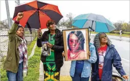  ?? ARVIN TEMKAR/ARVIN. TEMKAR@AJC.COM ?? (From left) Patricia Scott; Valerie HandyCarey, the mother of Brittany Glover; Dalphine Robinson; and Kathy Scott-Lykes watch a balloon release Friday at the intersecti­on where Glover was killed in 2022. Handy-Carey wants Finley Avenue Northwest renamed Brittany Glover Drive Northwest.