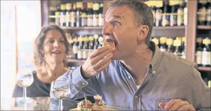  ?? NETFLIX ?? During the second season of “Somebody Feed Phil,” available Friday on Netflix, host Phil Rosenthal takes a joyful, wide-eyed approach to everything he experience­s in Venice, Italy.