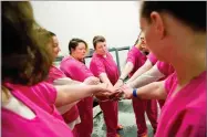  ?? AP PHOTO BY DAVID GOLDMAN ?? From left, cellmates Elsie Kniffen, 39, Mary Sammons, 41, Blanche Ball, 30 and Sarai Keelean, 35, join hands after a prayer in the Campbell County Jail in Jacksboro, Tenn., Tuesday, March 20.