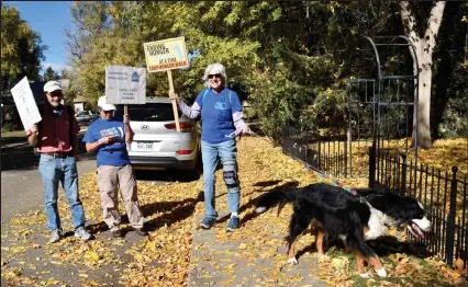 ?? Amy Bounds
Staff Writer ?? From left, Peter Ornstein, Beth Ornstein, Jean Magel and her dog, Sadie, walk through a Longmont neighborho­od during Sunday's Boulder County CROP Hunger walk.
/