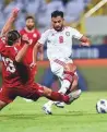  ?? Virendra Saklani/Gulf News ?? ■ UAE’s Majed Hassan (right) is tackled by Felix Michel Melki of Lebanon.