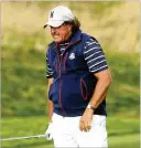  ?? JAMIE SQUIRE / GETTY IMAGES ?? U.S.’s Phil Mickelson reacts at No. 12 during afternoon foursome matches at the Ryder Cup. Mickelson and Bryson DeChambeau lost 5 and 4.
