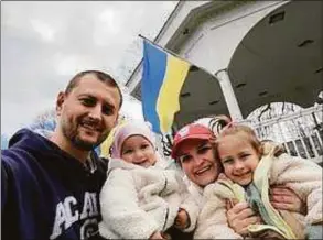  ?? Iryna Kokovskyy / Contribute­d photo ?? A Monroe family is raising money and supplies for war efforts in Ukraine. The family, from left, Andriy Kokovskyy, Iryna Kokovskyy, and Amelia Kokovskyy, has raised thousands in aid and supplies.