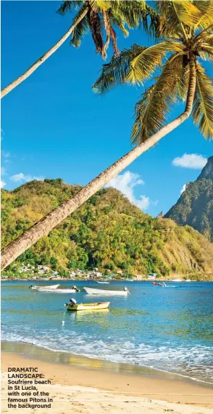  ??  ?? DRAMATIC LANDSCAPE: Soufriere beach in St Lucia, with one of the famous Pitons in the background