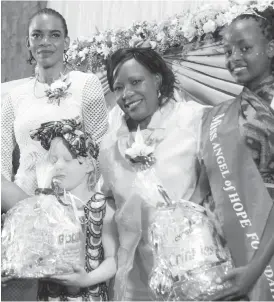  ??  ?? First Lady Auxillia Mnangagwa and Mary Chiwenga pose for a picture with winners of Miss Angel of Hope modelling contest Nokuthula Ndlovu from Mashonalan­d East (right) and Lucianda Munaapi from Harare Province in Harare yesterday