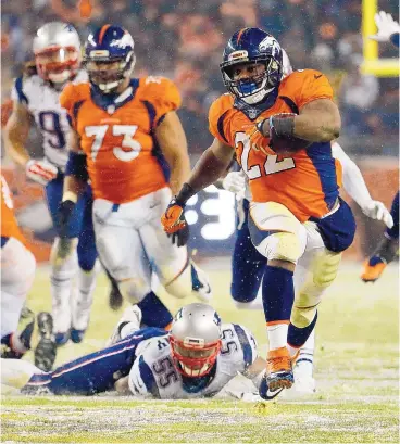  ?? JACK DEMPSEY/THE ASSOCIATED PRESS ?? Denver running back C.J. Anderson (22) breaks free for the game-winning touchdown in overtime Sunday night.