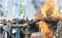  ?? PHOTO: AP ?? Burning anger . . . Pakistani protesters burn an effigy of Indian Prime Minister Narendra Modi during an antiIndian rally in Peshawar, Pakistan, early yesterday.