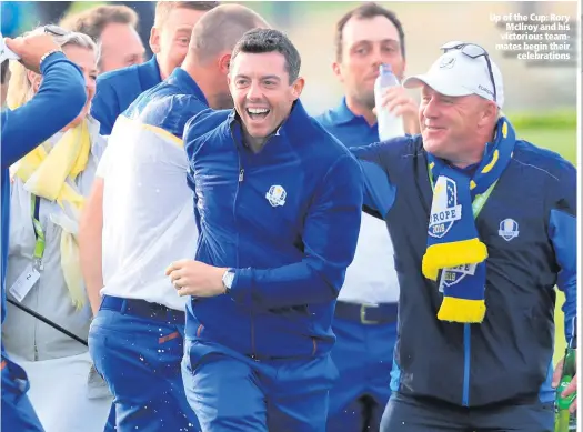  ??  ?? Up of the Cup: RoryMcIlro­y and his victorious teammates begin theirceleb­rations