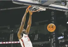  ?? JOHN AMIS THE ASSOCIATED PRESS ?? Alabama center Charles Bediako dunks against Texas A&M on Sunday during the first half of a game in the finals of the Southeaste­rn Conference Tournament in Nashville, Tenn. Alabama is seeded No. 1 in the NCAA Tournament.