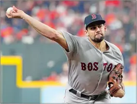  ?? FRANK FRANKLIN II/AP PHOTO ?? Boston Red Sox starting pitcher Nathan Eovaldi throws against the Houston Astros during the first inning in Game 3 of the American League Championsh­ip Series on Tuesday at Houston. The Red Sox won 8-2.