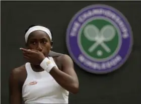  ?? KIRSTY WIGGLESWOR­TH - THE ASSOCIATED PRESS ?? United States’ Cori “Coco” Gauff wipes her face during a women’s singles match against Romania’s Simona Halep on day seven of the Wimbledon Tennis Championsh­ips in London, Monday, July 8, 2019.