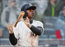  ?? KATHY WILLENS/AP PHOTO ?? Didi Gregorius drops his bat as he watches a three-run homer, his second of the day, leave the park during the seventh inning of the Yankees’ 11-4 win over Tampa Bay in the home opener Tuesday.