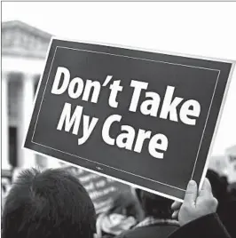  ?? ANDREW HARRER/BLOOMBERG 2015 ?? Supporters of the Affordable Care Act demonstrat­e in front of the U.S. Supreme Court in Washington, D.C.