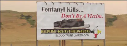  ?? CP PHOTO ?? A billboard at the east end of the Blood Reserve in southern Alberta warns about the dangers of fentanyl. Fentanyl addiction has led to several deaths and overdoses.