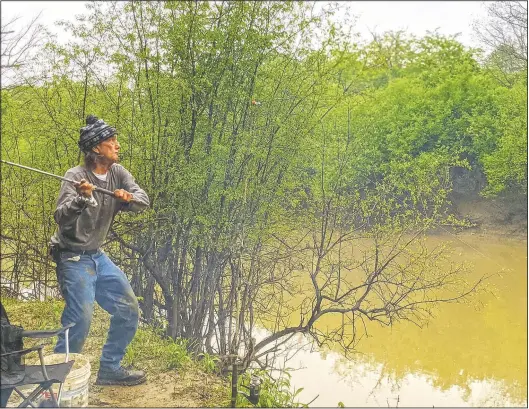  ?? (The Southern Illinoisan/Byron Hetzler) ?? Dwight J. Violette casts a line along the Big Muddy River near Carbondale, Ill. Violette said he came to Carbondale after spending more than 20 years in prison.