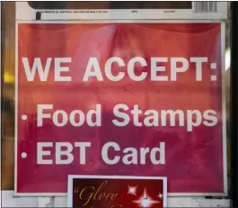  ?? SCOTT HEINS — GETTY IMAGES ?? A sign alerting customers about SNAP food stamps benefits is displayed at a Brooklyn grocery store on Dec. 5, 2019, in New York City.