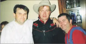 ?? ?? All smiles for the camera during T.O.’s Country Music Roadshow at Spratt’s Bar, Mitchelsto­wn in October 2002, were l-r: Liam O’Grady, T.O. Flynn and Tom Gallagher.