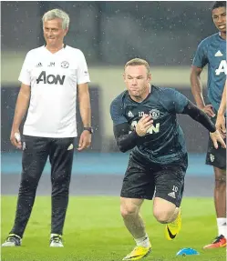  ?? Picture: AP. ?? Wayne Rooney says training under Jose Mourinho has been hard but enjoyable.