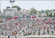  ?? ANI ?? Migrants wait for a train in Bhopal on May 16.