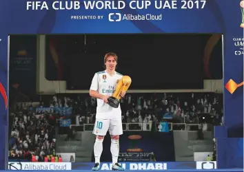  ?? Courtesy: Action Global Communicat­ion ?? Newly crowned Fifa Best Men’s Player Luka Modric collects the trophy for Outstandin­g Player at the Fifa Club World Cup UAE 2017. Modric will be back in Abu Dhabi in December.