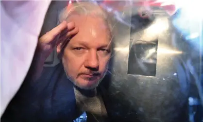  ?? Photograph: Daniel Leal/AFP/Getty Images ?? ‘Assange has been enfeebled by two years in a harsh UK prison, to the point allegedly of suffering a stroke, forced to sustain strip searches and handcuffs.’