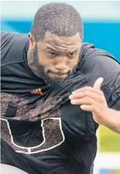  ?? JOE CAVARETTA/SUN SENTINEL ?? NFL prospect Danny Isadora from UM goes through a sprint at the Pete Bommarito performanc­e camp.