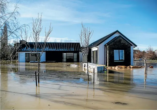  ?? PHOTO: GEORGE HEARD/STUFF ?? Flooding hits a newly built home in Outram in Otago.