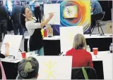  ?? JOHN LAW THE NIAGARA FALLS REVIEW ?? Above: Niagara Falls artist Evelyn Bailey conducts an art class during Saturday's Falls 420 Expo at Scotiabank Convention Centre.