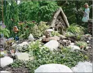  ?? CONTRIBUTE­D PHOTO ?? This tiny Fairy Garden decorated for Memorial Day, Flag Day and July 4th, sits outside the sales office at Grandma’s Gardens in Waynesvill­e.