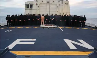  ?? MADISON CROSS THE CANADIAN PRESS ?? The crew of a Royal Canadian Navy frigate held a ceremony on Sunday to mark the transfer of the body of one of six personnel who died in a crash of a CH-148 Cyclone helicopter.