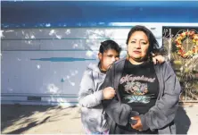  ?? Yalonda m. James / The Chronicle 2018 ?? Reina Tello and her daughter, Alyssa, 10, stand in front of the home in S.F.’s Bayview two days after they were evicted.