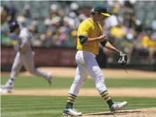  ?? Ben Margot / Associated Press ?? A’s starter Daniel Mengden gives up a two-run homer to the Brewers’ Scooter Gennett (left) in the fifth inning.