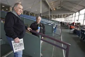  ?? NATI HARNIK - THE ASSOCIATED PRESS ?? Ron Tenski and Jerry Moritz, left, who had arrived to Fonner Park in Grand Island, Neb., for the horse races, Saturday, March 14, 2020, leave after the races were called off due to dangerous track conditions following snowfall.