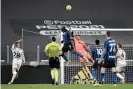  ?? Photograph: Daniele Badolato/Juventus FC/Getty Images ?? Gianluigi Buffon in action last month, saving a header from Romelu Lukaku of Inter.