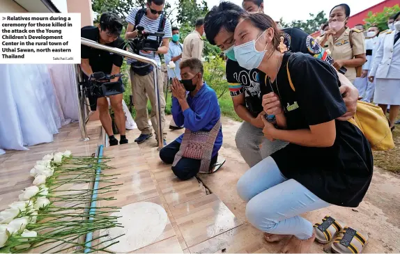  ?? Sakchai Lalit ?? > Relatives mourn during a ceremony for those killed in the attack on the Young Children’s Developmen­t Center in the rural town of Uthai Sawan, north eastern Thailand