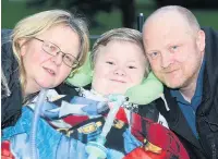  ??  ?? ●●Harvey with his mum Michelle and dad John McCabe